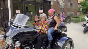 Doris McGee waves to everyone as she takes in the moment.